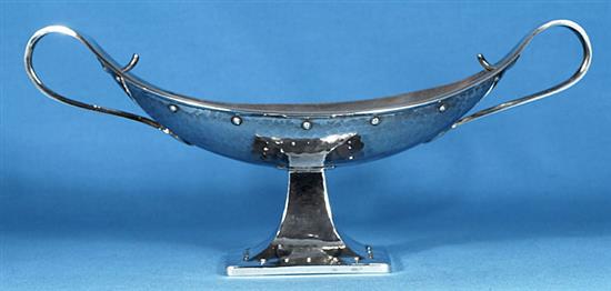 A George V Arts & Crafts silver navette shaped two handled dish, by Albert Edward Jones, Width 12 ¾”/320mm Weight: 18.3oz/520grms